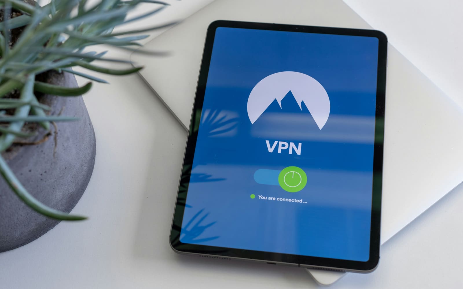 A tablet showing a VPN app connected